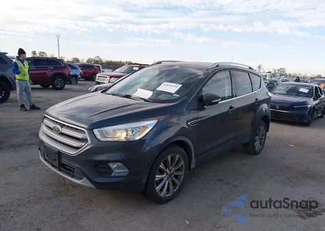 2017 Ford Escape Titanium z USA, uszkodzony, nr VIN 1FMCU0J93HUC49195